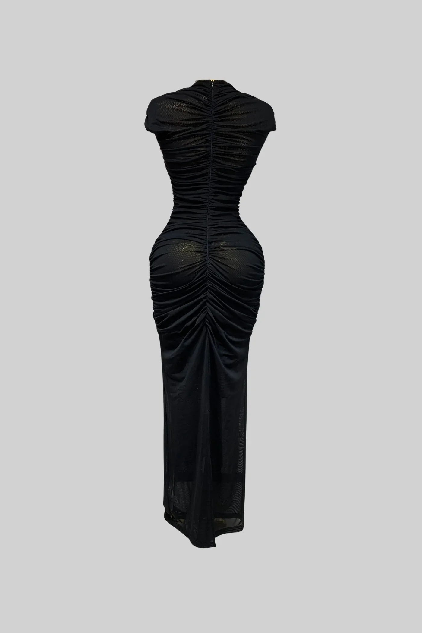Black dress with ruched design on a gray background