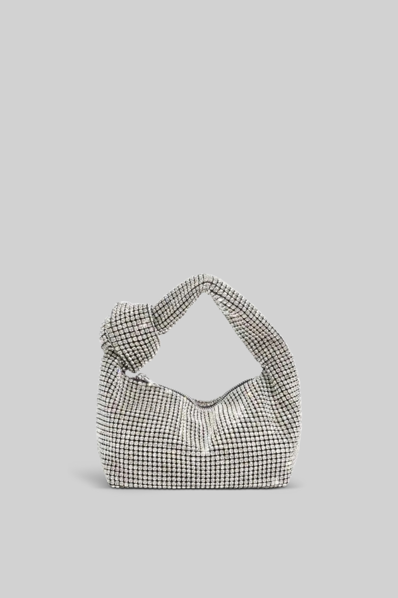 Houndstooth patterned handbag on a light gray background