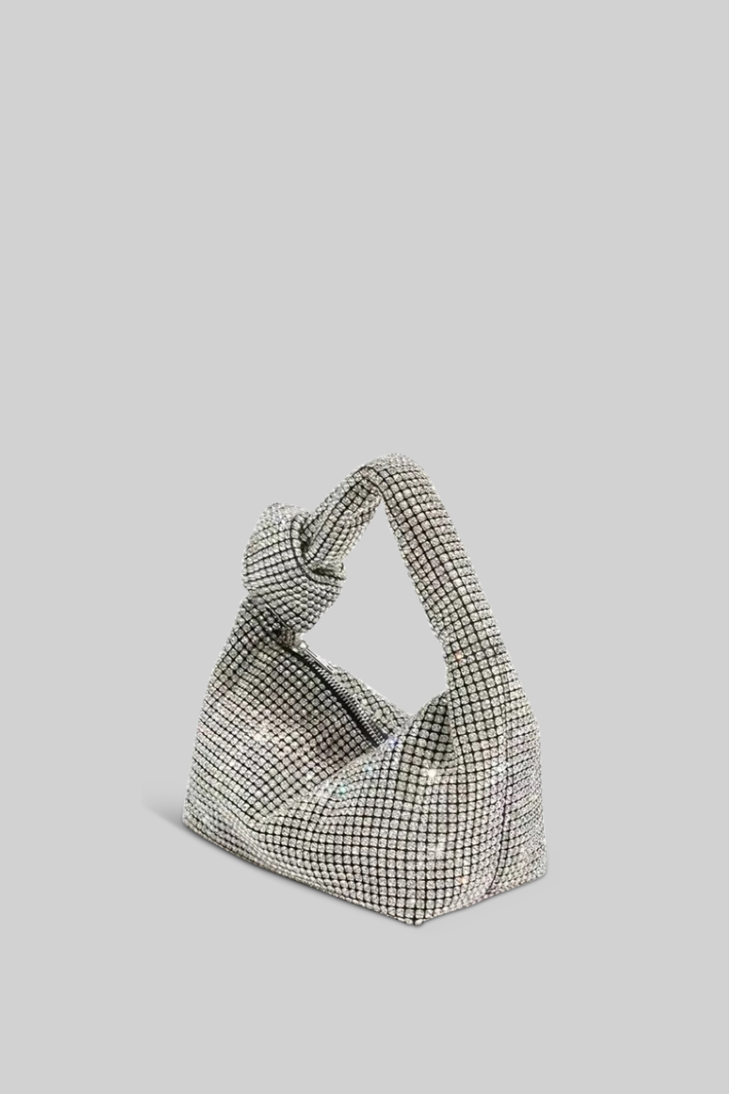 Grid-patterned handbag on a light gray background