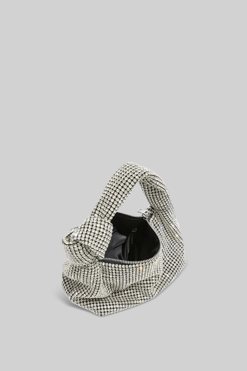 Houndstooth patterned handbag on a light gray background