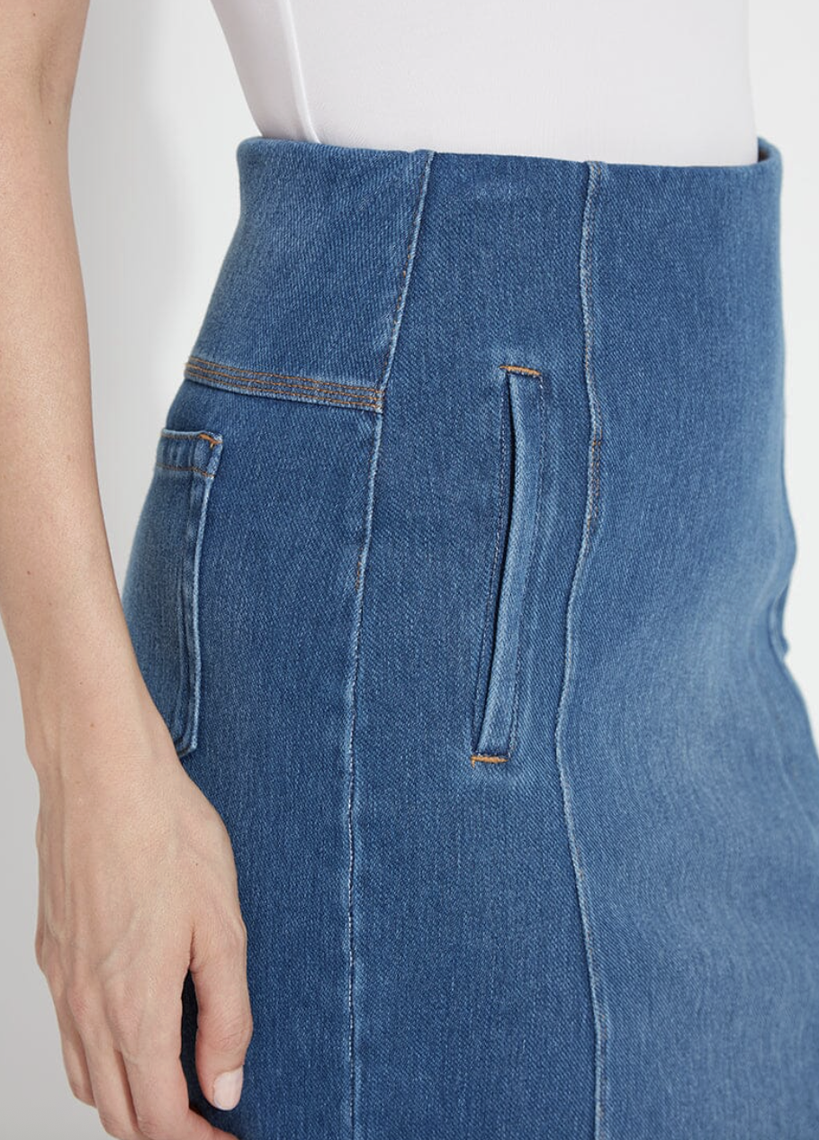 Close-up of blue jeans with a white background