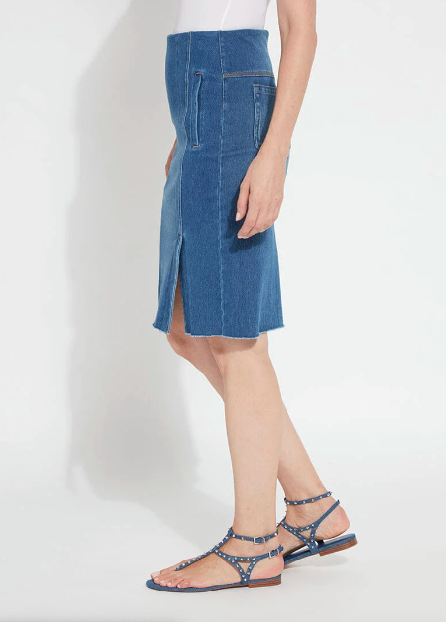Person wearing a blue denim skirt on a white background