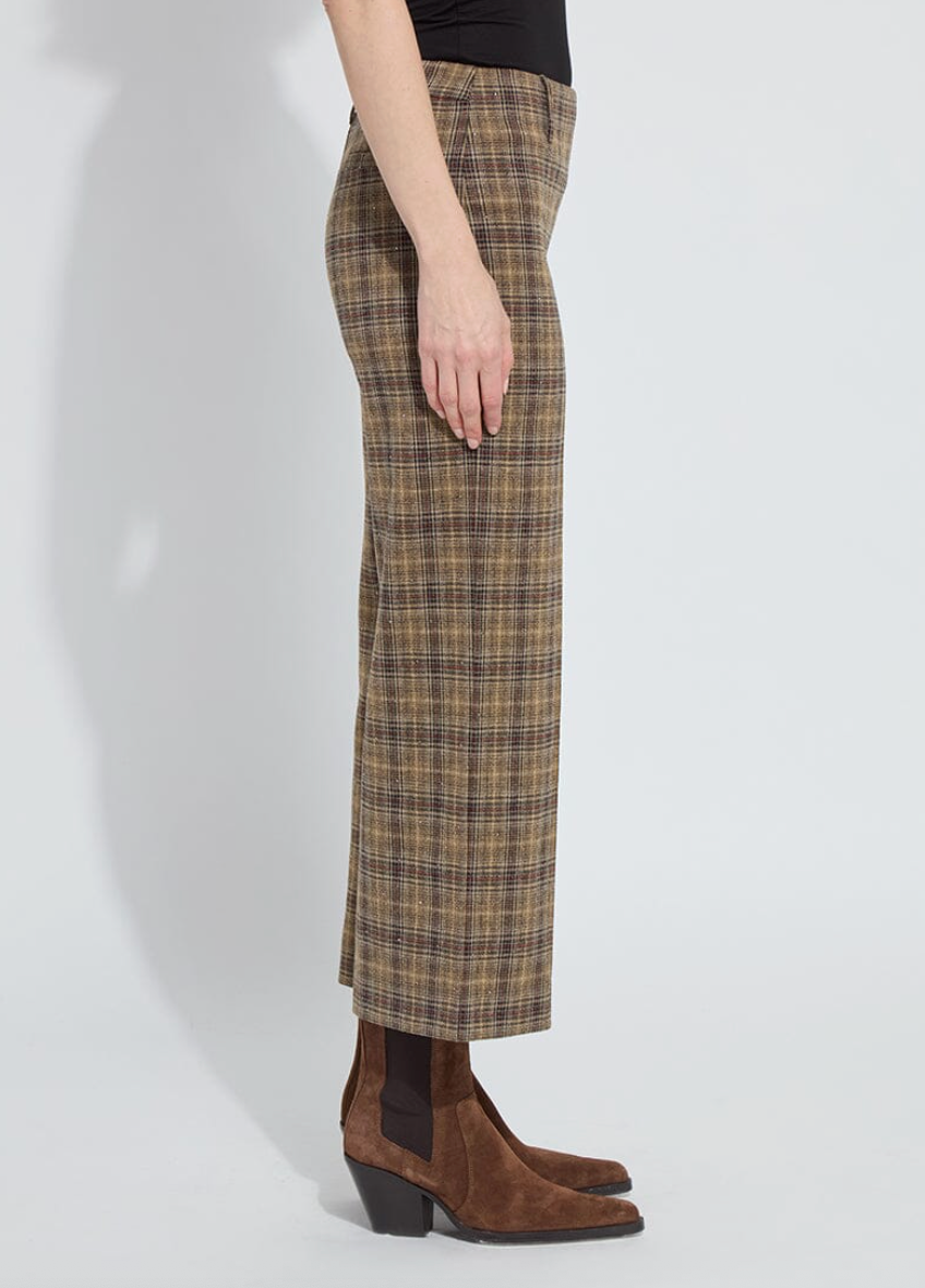 Plaid skirt worn by a person on a white background