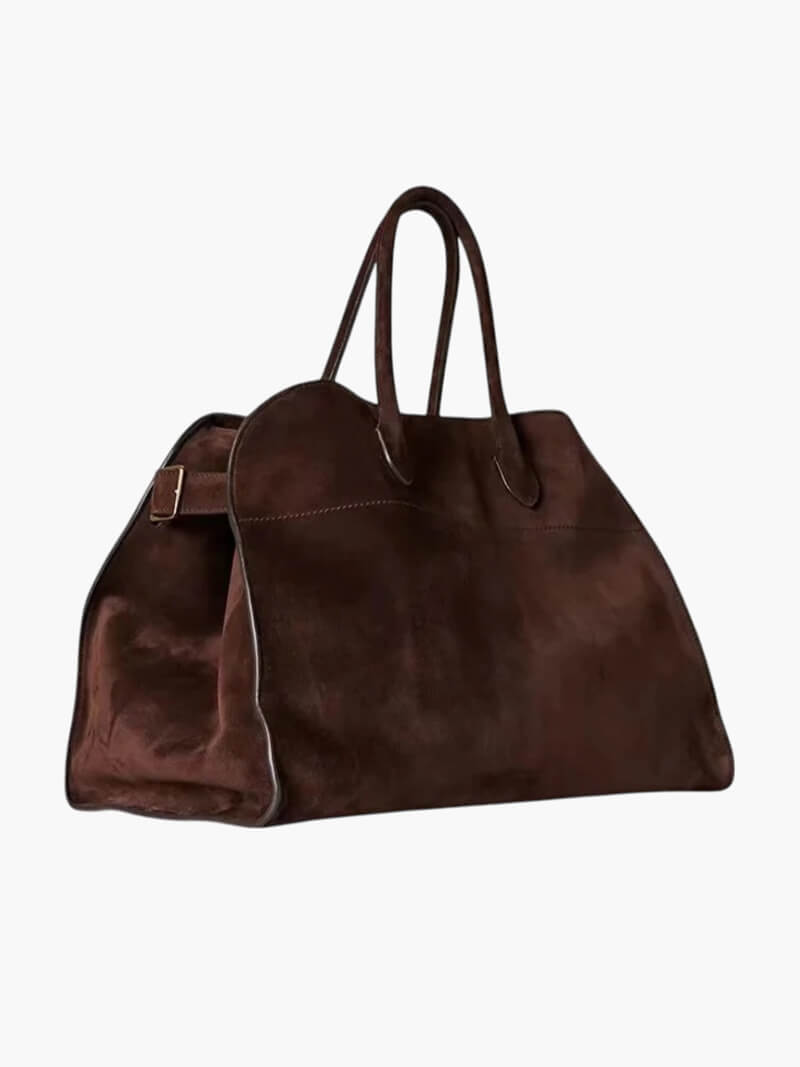 Brown leather handbag on a white background