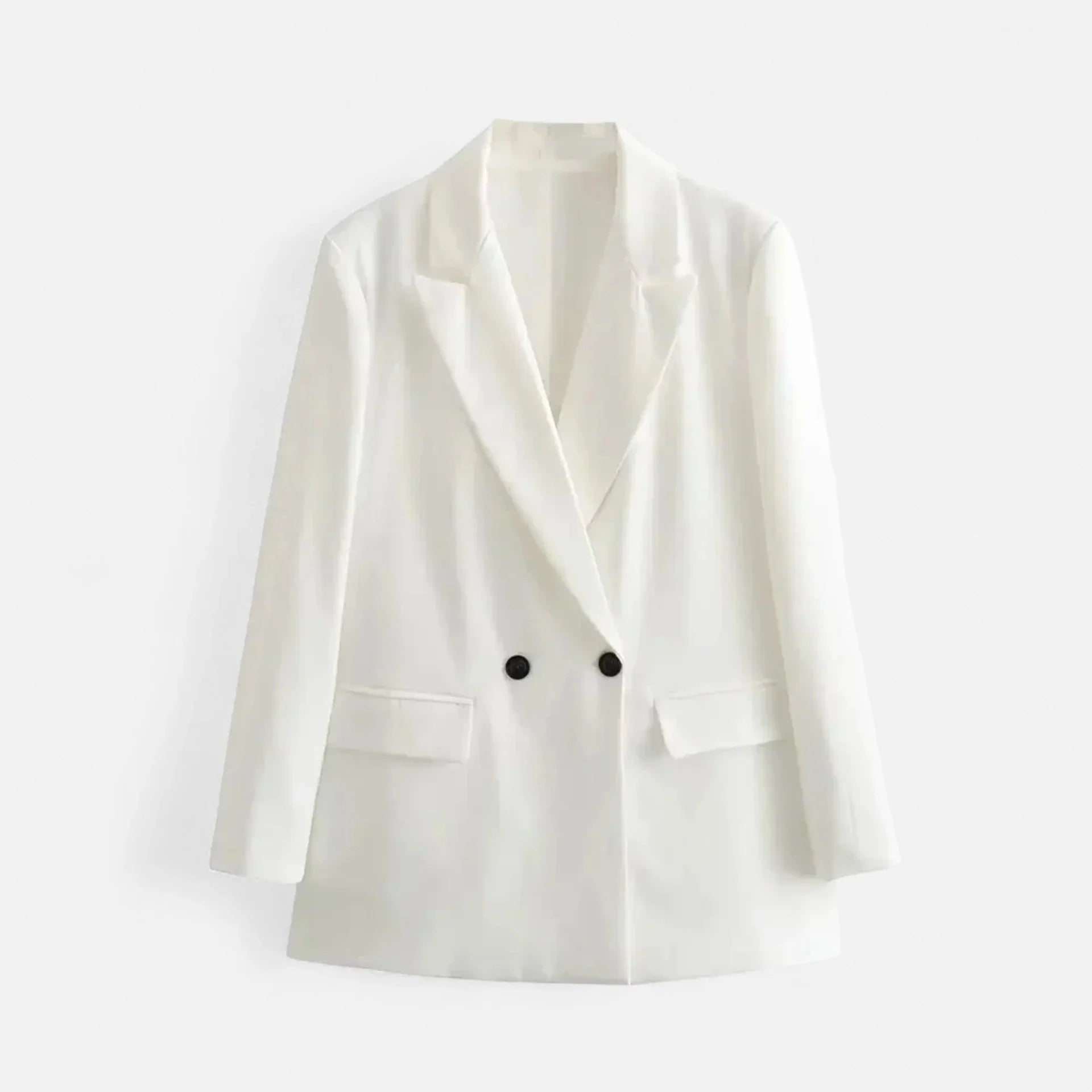 White blazer with black buttons on a light gray background