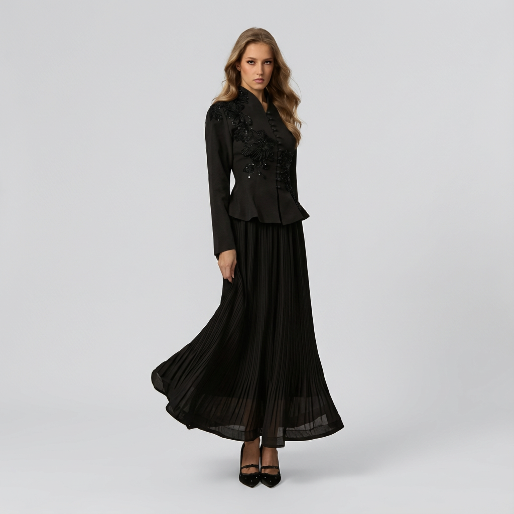 Woman wearing a black dress with a jacket on a gray background