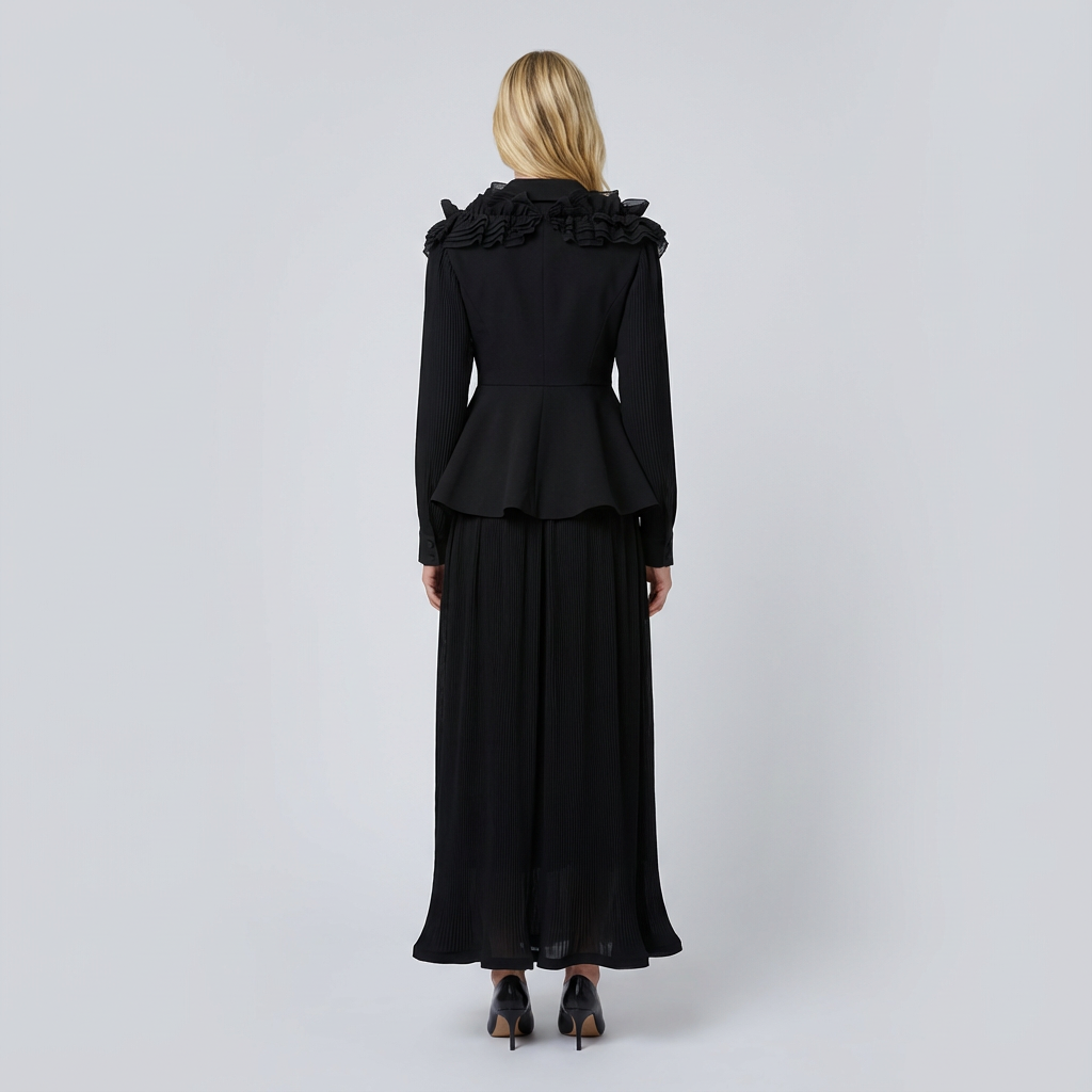 Woman wearing a black peplum dress with ruffled collar on a white background