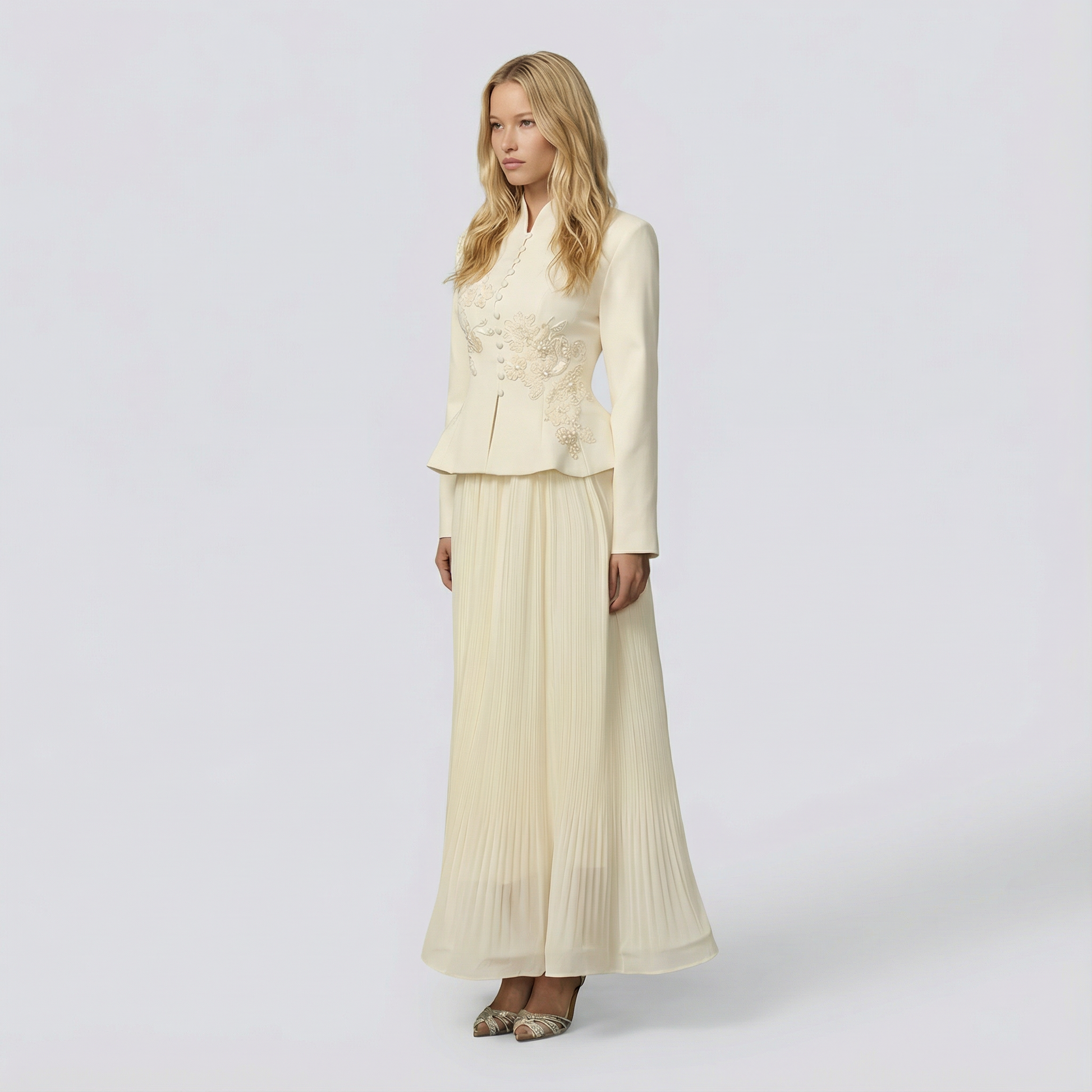 Woman wearing a cream-colored suit with a white background