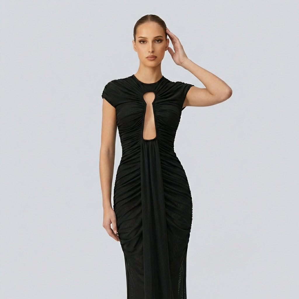 Black evening gown with cut-out design on a gray background